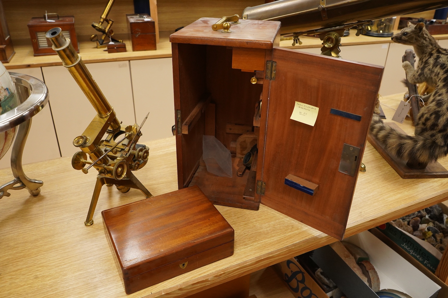 A fine mid 19th century brass compound monocular microscope, by Powell and Lealand, 170, Euston Road, London, dated 1869, mahogany cased, together with a mahogany cased accessory box, containing - 7 objectives, 4 Leiberk